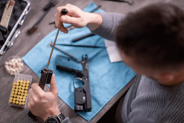 gunsmith cleaning a firearm