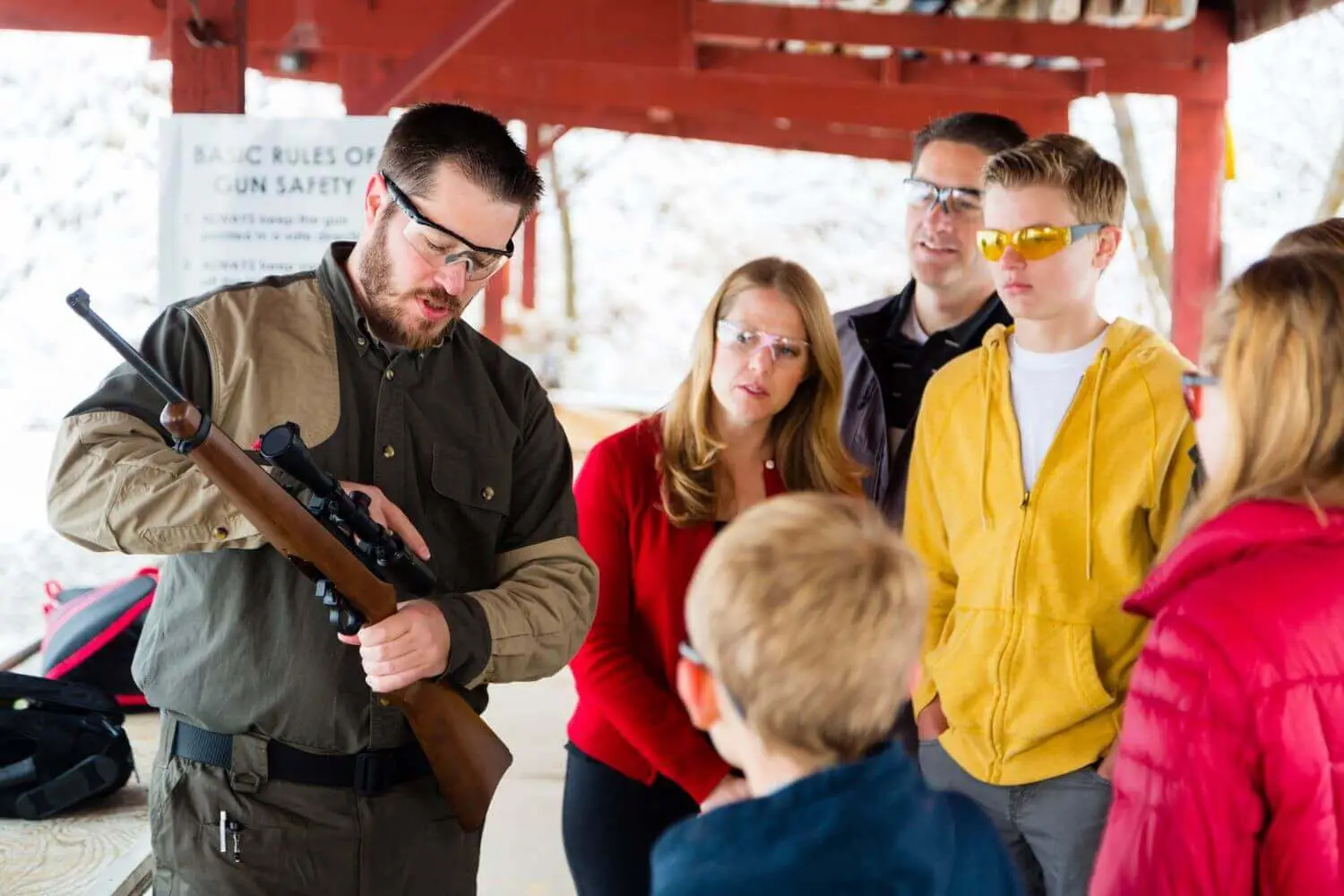 image-3 - Premier Gun Parts And Accessories | JSD Supply A group of people listening intently to a firearms training instructor