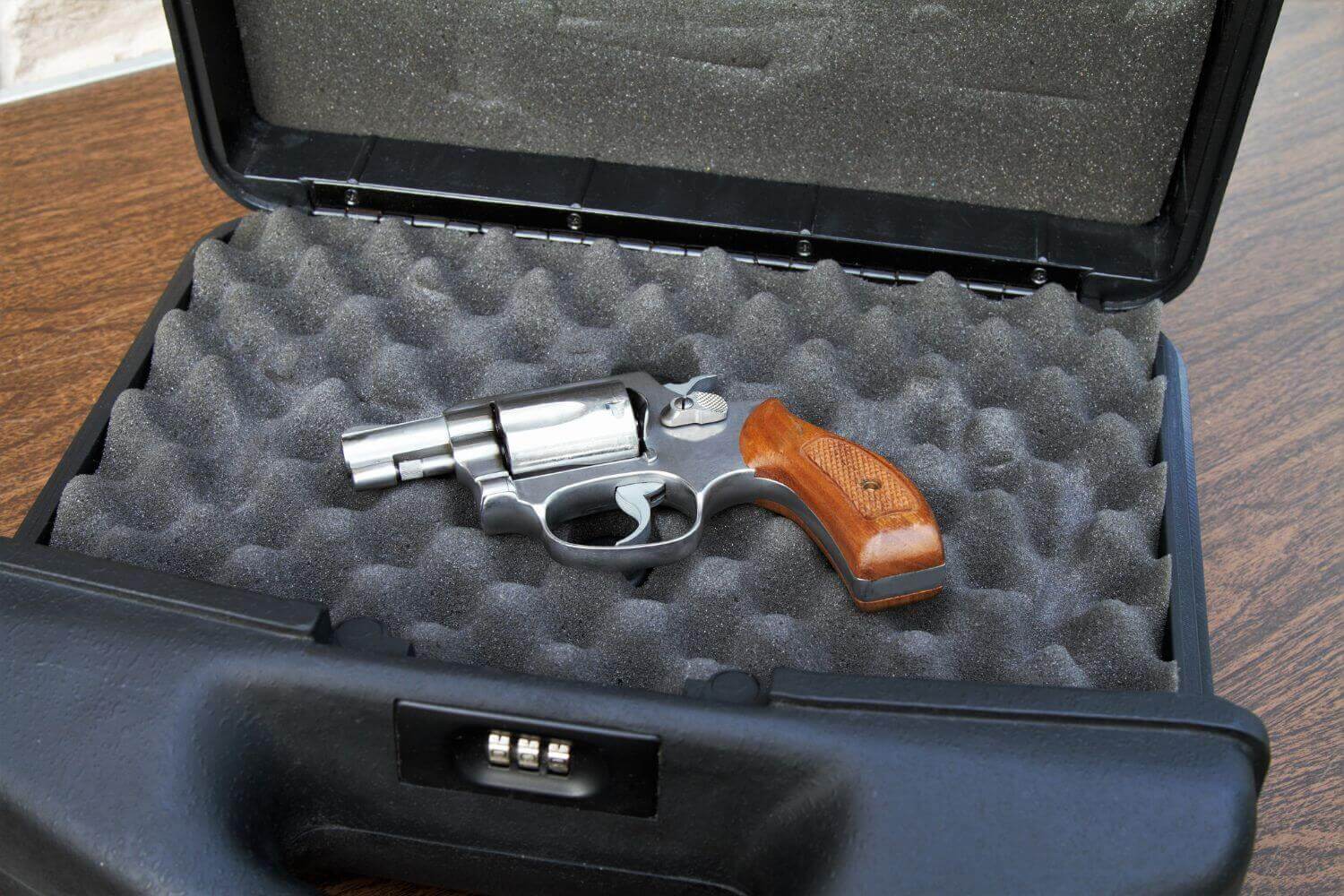 A personal firearm stored in a combination lock case