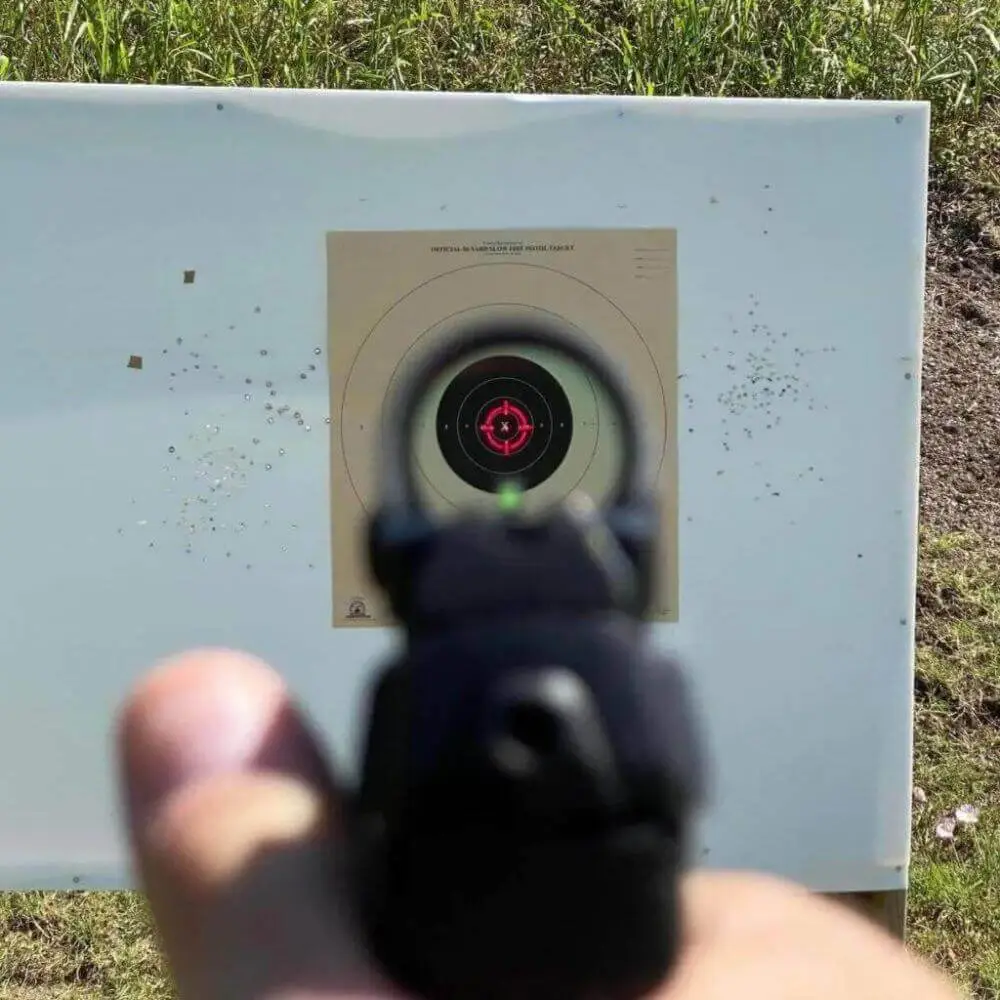 View through an optic showing red dot reticle