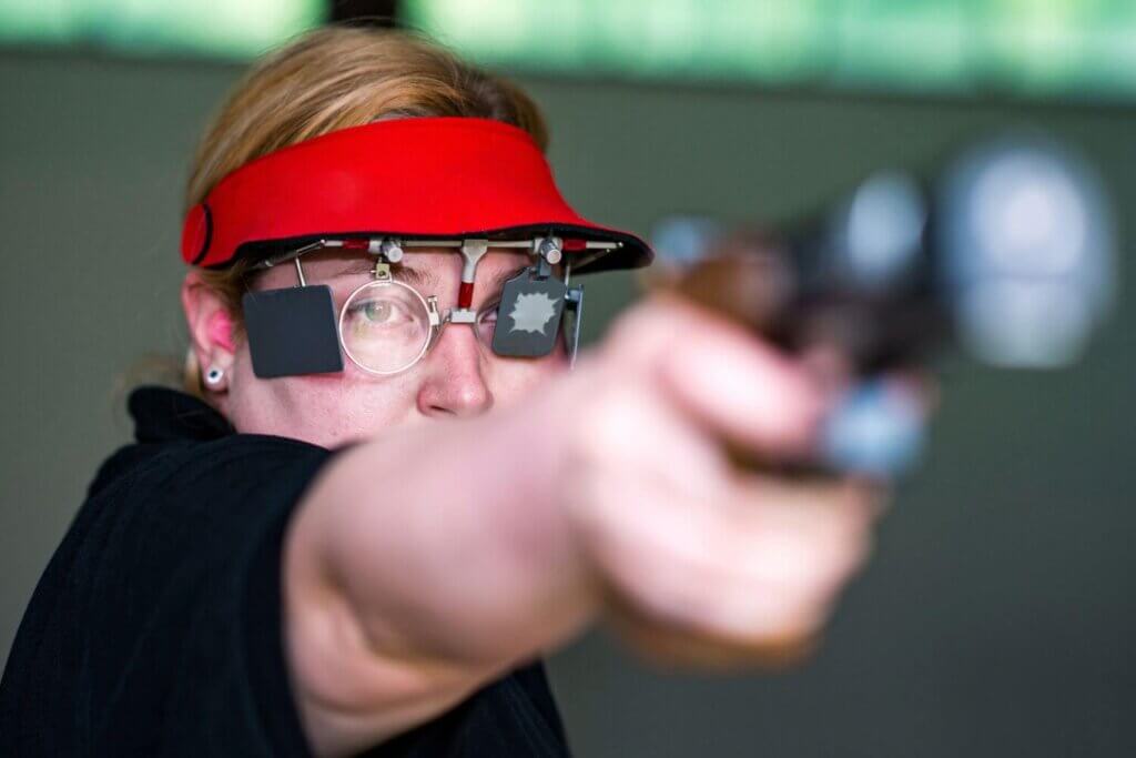 Woman in a pistol sport shooting competition
