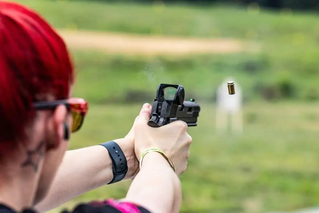 woman shooting a pistol with a Gideon Optics red dot optic mounted - Premier Gun Parts And Accessories | JSD Supply woman shooting a pistol with a Gideon Optics red dot optic mounted