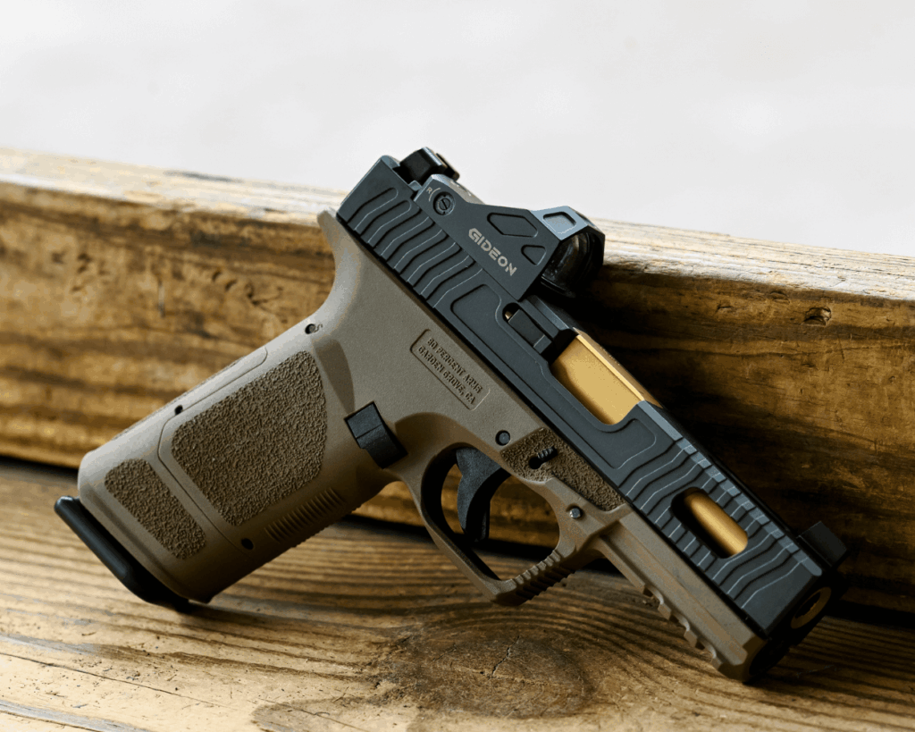 custom built pistol sitting on a wood table - JSD Supply | Premier Gun Parts And Accessories custom built pistol sitting on a wood table